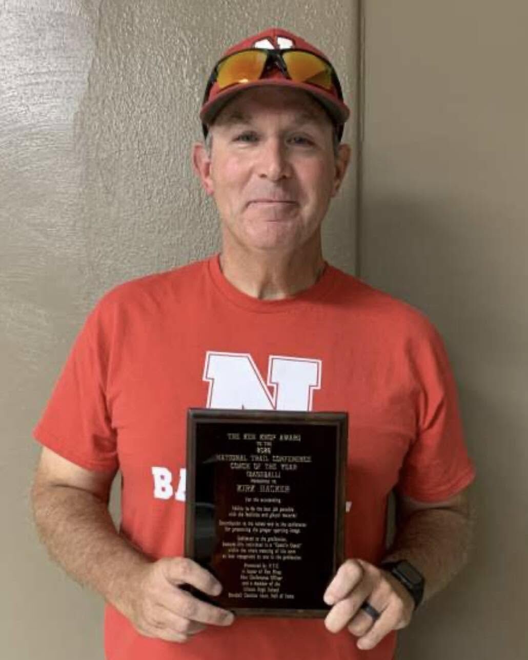 Man holding a plaque award