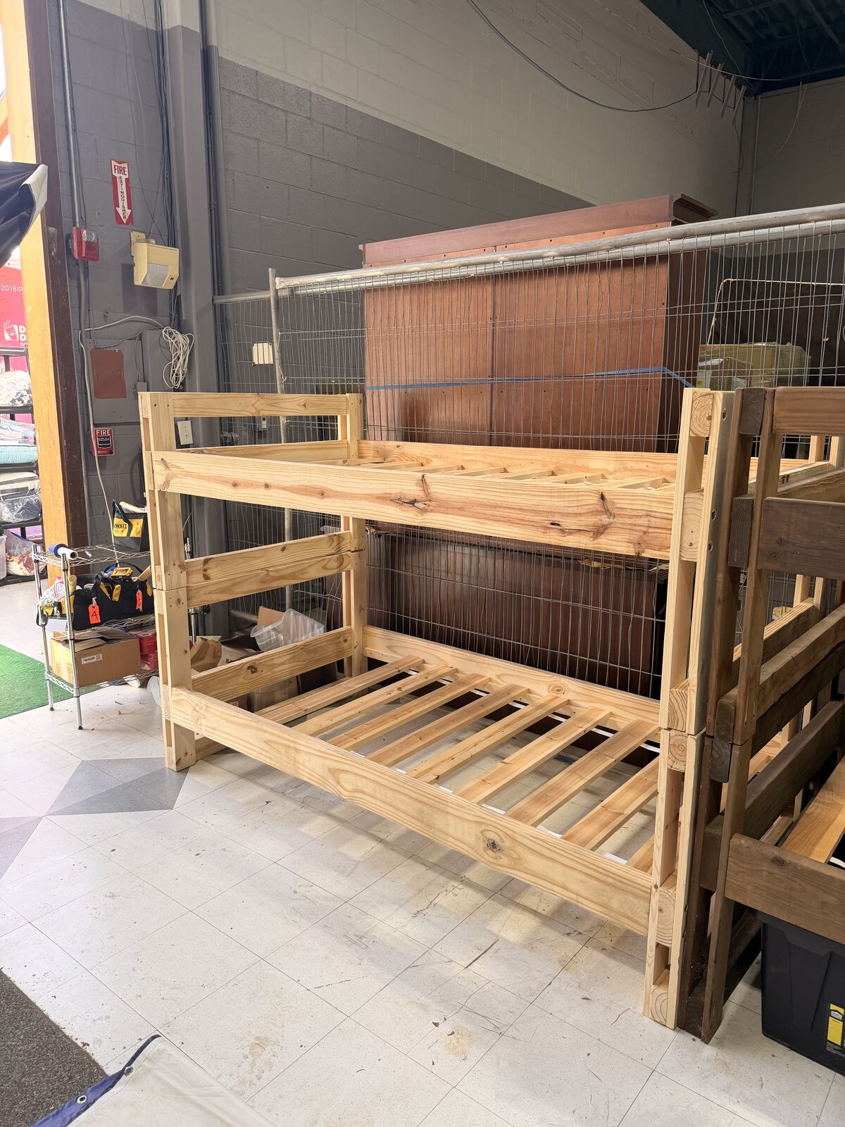 A completed wooden bunk bed frame assembled and ready for delivery.