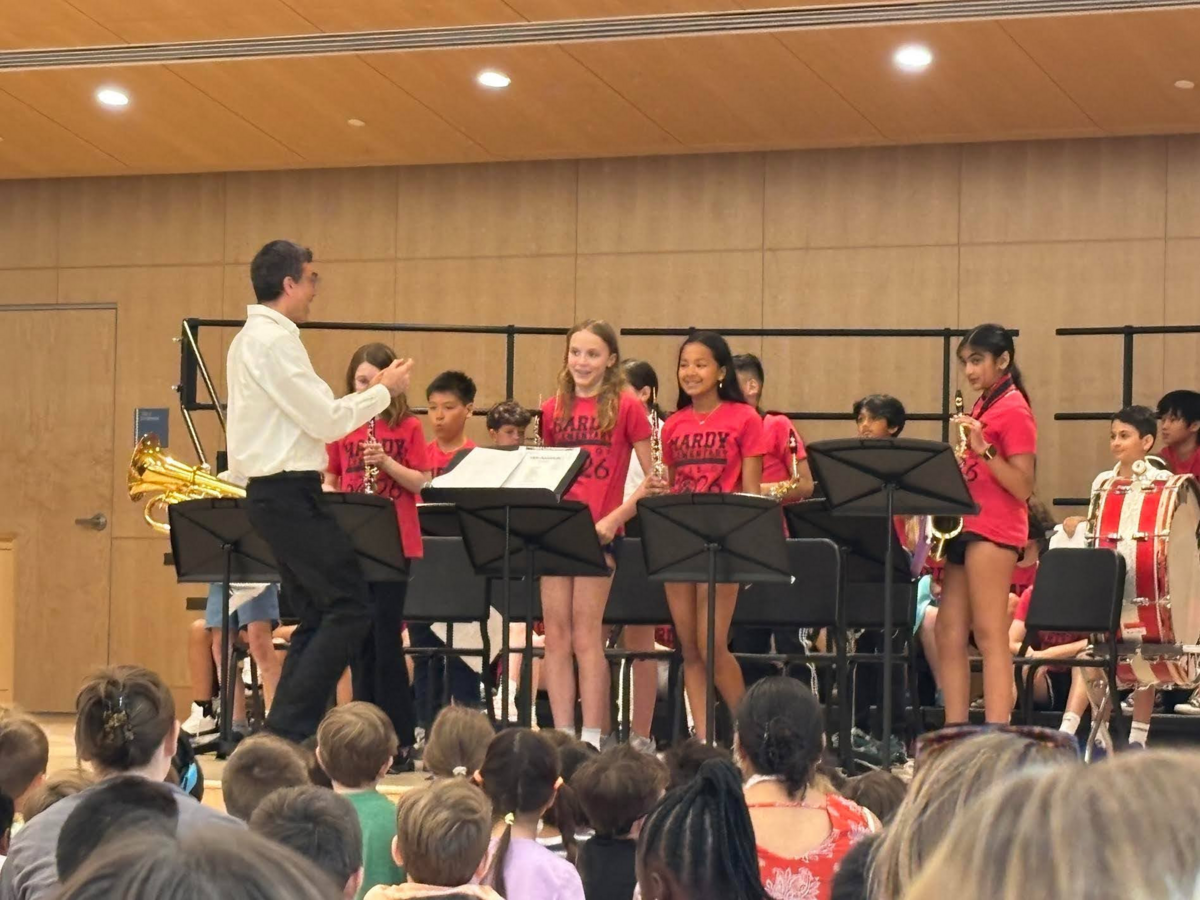 Hardy students perform in the band on stage during the Hardy assembly.
