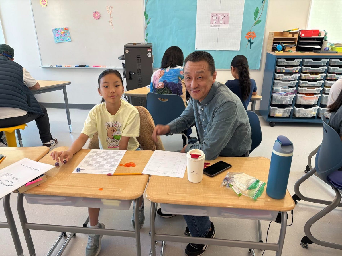 A student and her parent or guardian work on a math exercise during a math-in.
