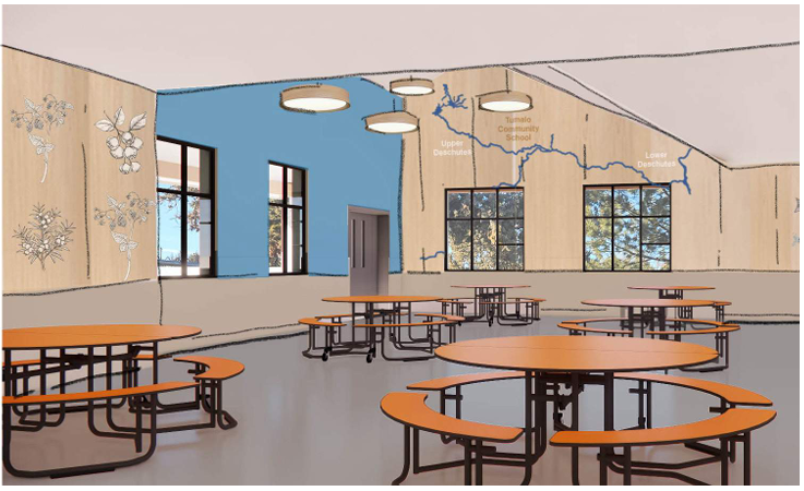 A bright, modern cafeteria with orange picnic tables and benches.
