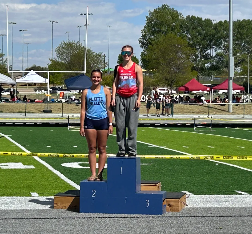 Kiana Fernandez standing at the top of the podium
