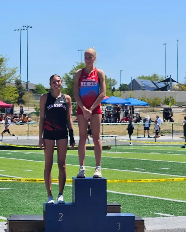 Sophie standing at the top of the podium for high jump