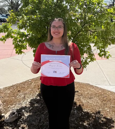 Maryssa Zornes holding her award
