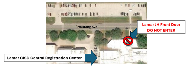 Overhead view of a building complex with street names and directional arrows.
