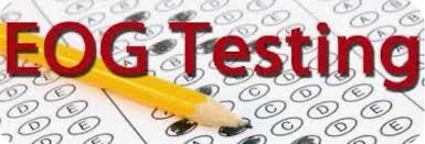 A yellow pencil rests on a test paper with multiple-choice bubbles, with the text 'EOG Testing' prominently displayed.