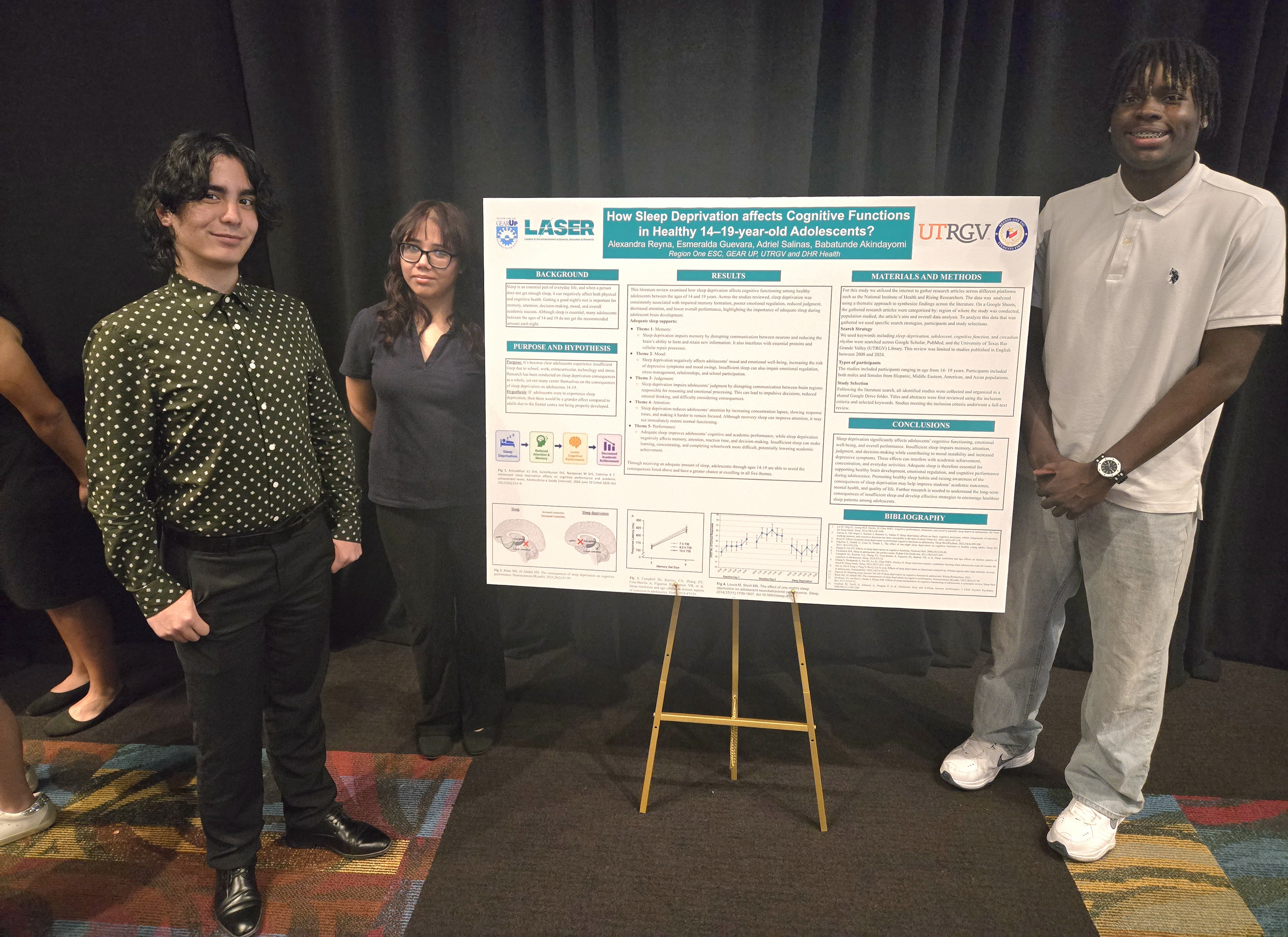 Three students proudly stand beside their scientific research poster titled 'How Sleep Deprivation affects Cognitive Functions'.