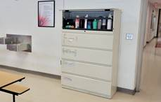 A file cabinet with a shelfDescription automatically generated with medium confidence