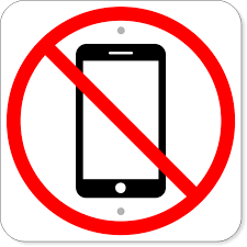 A sign with a red circle and a diagonal line over a smartphone icon, indicating no phones allowed.