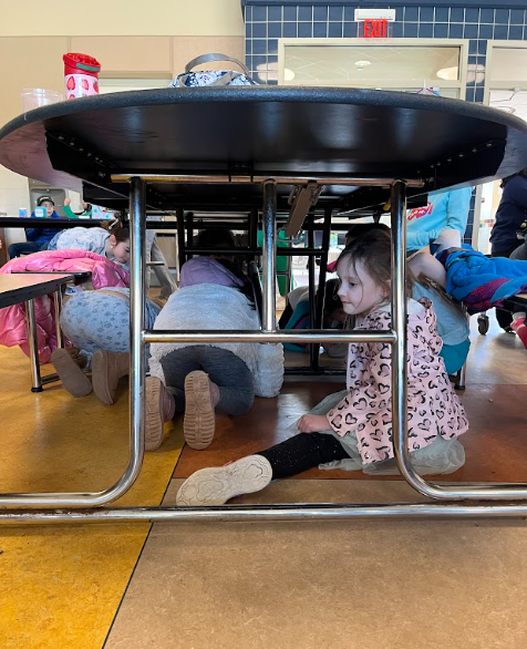 Kids scatter under the tables looking for lucky tickets.