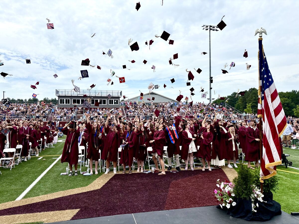2026 Graduation - end of graduation. Students tossing their caps into the air to celebrate
